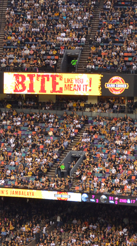 The 'Bite Like You Mean It' message displayed on the Caesars Superdome jumbotron during a Saints game
