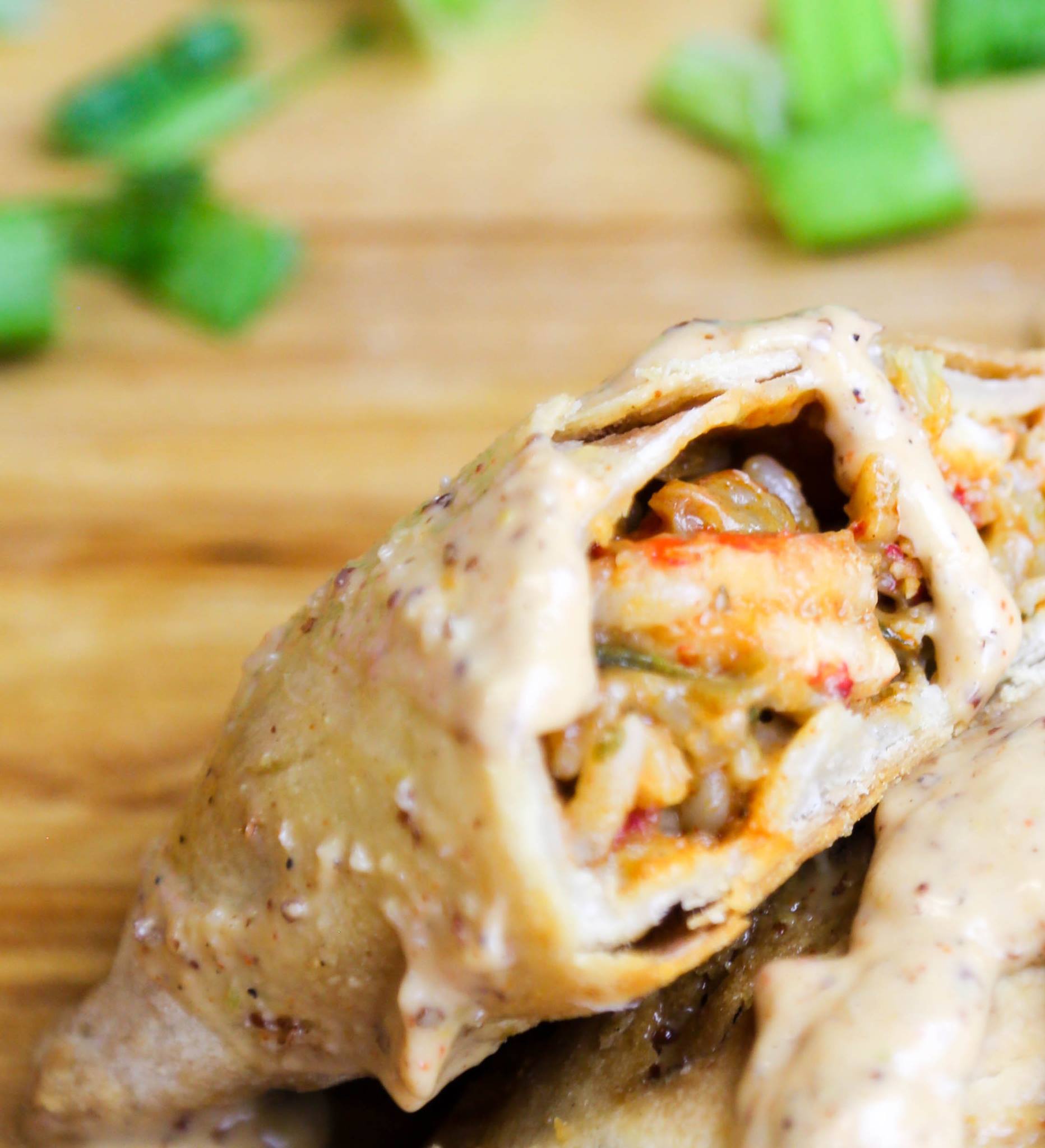 A flaky golden crawfish hand pie drizzled with rémoulade sauce