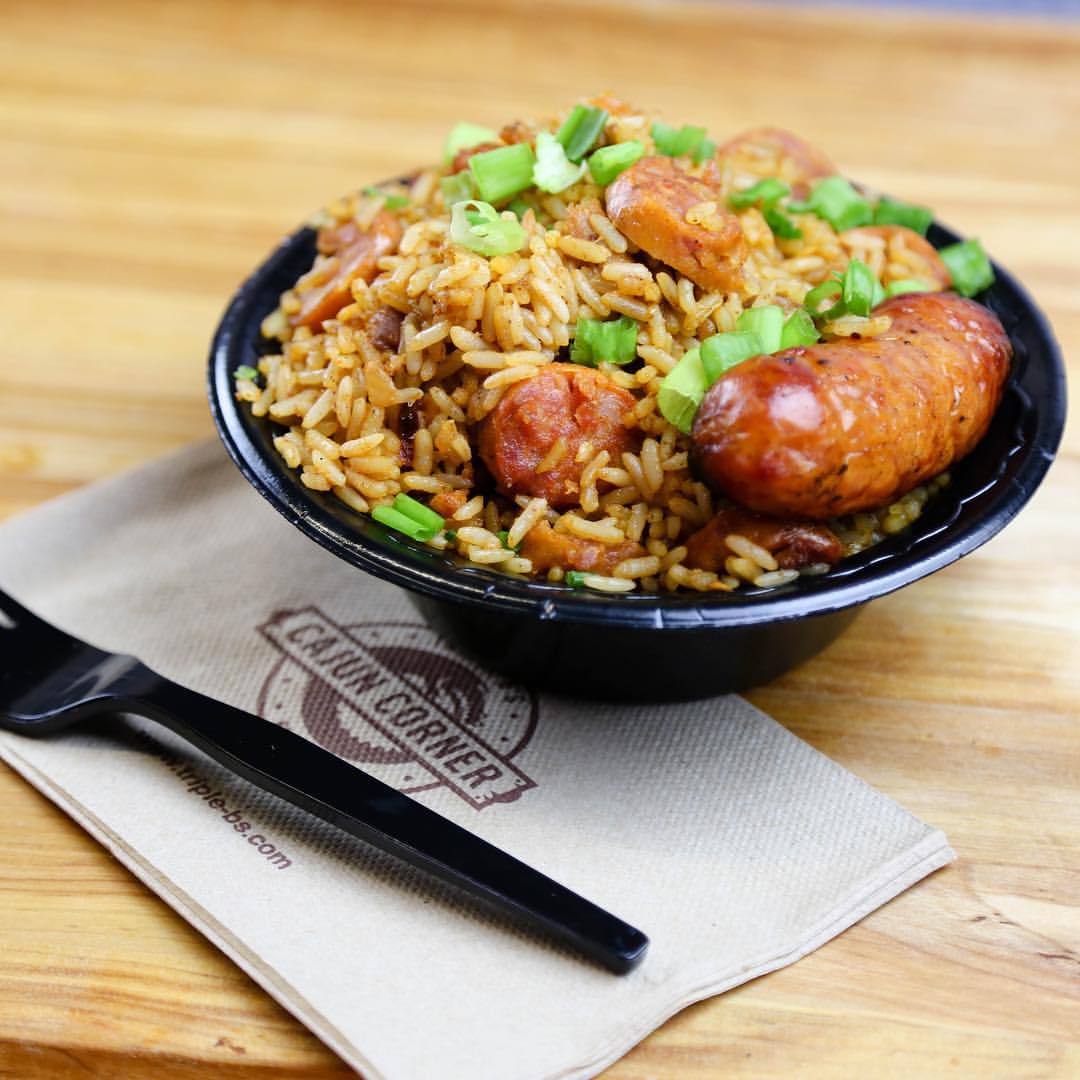 A bowl of Triple B's jambalaya — rice, smoked sausage, and chicken with green onion